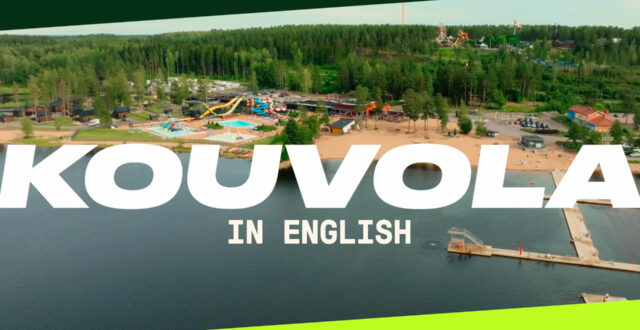 Ilmakuva Käyrälammesta. Päällä Kouvolan logo, teksti "in english" ja viisteet.