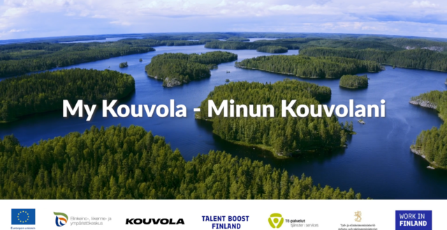 Ilmakuva Kouvolasta. Järviä ja metsää. Päällä teksti: My Kouvola - Minun Kouvolani. Alla sponsorien logoja.